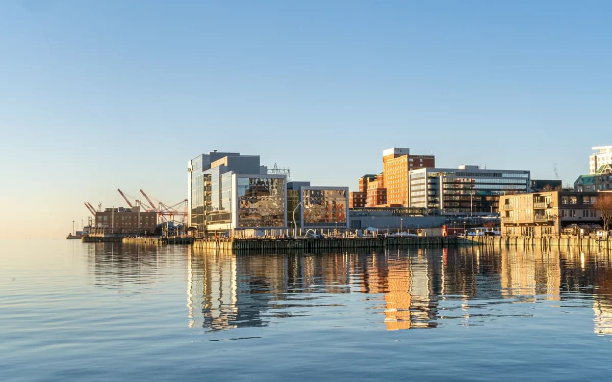 Halifax waterfront and downtown buildings reflected in calm harbour water